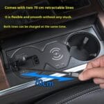 In-car wireless charging pad with a 70 cm retractable line being pulled from the console slot.