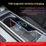 In-car 15W magnetic wireless charger with anti-slip panel charging a smartphone mounted in the center console.