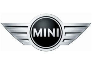 MINI logo featuring a black circular center with silver border and winged chrome wings extending outward.
