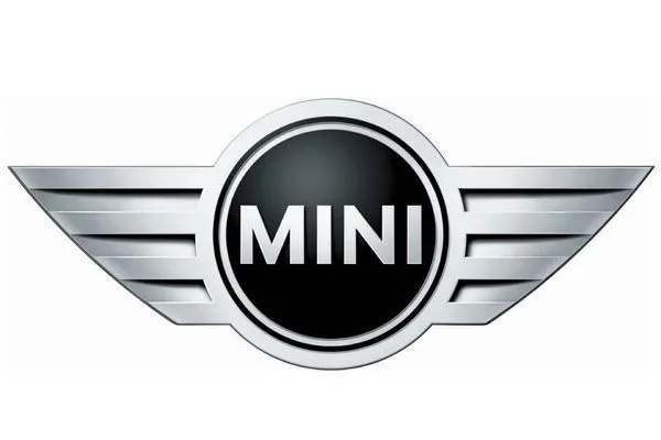 MINI logo featuring a black circular center with silver border and winged chrome wings extending outward.